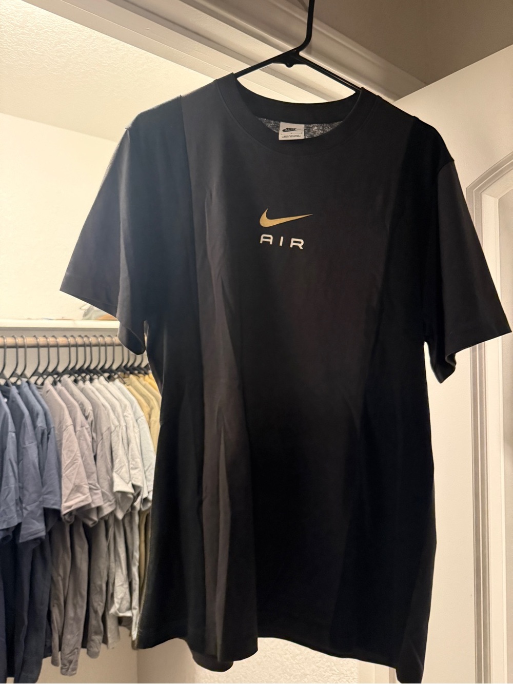 Nike Men's Black T-Shirt with Gold Air Logo
